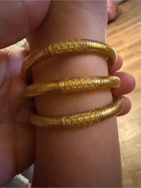 Gold set of 3 Budhagirl kids bracelets with travel bags